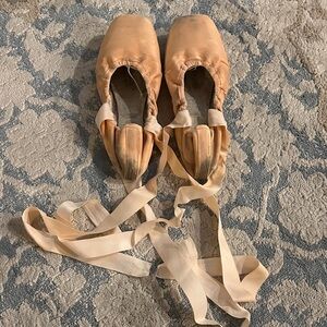 Used ballet pointe shoes with attached ribbons